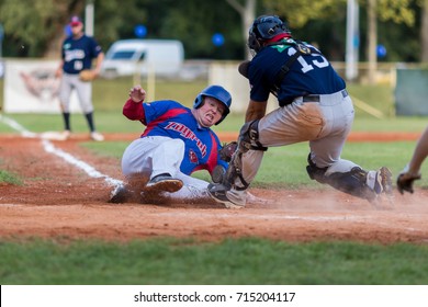 ZAGREB, CROATIA - SEPTEMBER 09, 2017: Baseball Match Between Baseball Club Zagreb And BK Olimpija 83. Baseball Runner Sliding On Home Base