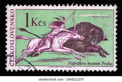 ZAGREB, CROATIA - SEPTEMBER 18, 2014: Stamp Printed In Czechoslovakia Shows The Scene Of Buffalo Hunting, A Native American Indian On Horseback, Pursue A Bison Galloping, Circa 1966