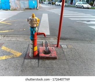 Zagreb/Croatia-April, 17th,2020: Old Water Pump Painted As Homage To Piet Mondrian`s Red, White, Yellow And Blue Rectangles That Became His Main Identity   

