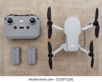 Zajecar, Serbia - 05.04.2022 : Small Gray Drone With Controller And Battery From Above