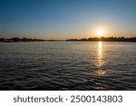 Zambezi sunset boat cruise on the Zambezi River at Victoria Falls, Mosi-oa-Tunya, is a waterfall on the Zambezi River, located on the border between Zambia and Zimbabwe.