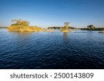 Zambezi sunset boat cruise on the Zambezi River at Victoria Falls, Mosi-oa-Tunya, is a waterfall on the Zambezi River, located on the border between Zambia and Zimbabwe.