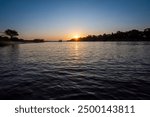 Zambezi sunset boat cruise on the Zambezi River at Victoria Falls, Mosi-oa-Tunya, is a waterfall on the Zambezi River, located on the border between Zambia and Zimbabwe.