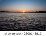 Zambezi sunset boat cruise on the Zambezi River at Victoria Falls, Mosi-oa-Tunya, is a waterfall on the Zambezi River, located on the border between Zambia and Zimbabwe.