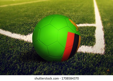 Zambia flag on ball at corner kick position, soccer field background. National football theme on green grass. - Powered by Shutterstock