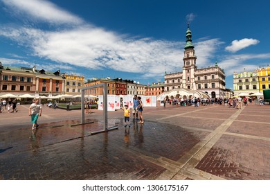 ZAMOSC, POLAND -  8 JUL: Daily Life In Zamosc On JUL 8, 2018. Town Hall At The Center Of The Old Town In Zamosc