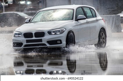 ZANDVOORT, NETHERLANDS - JUL 18, 2017: BMW Car Slipping/drifting In Water Reflections