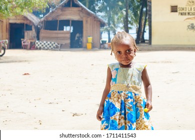 Zanzibar, Tanzania - February 2020: lovely African little girl with big eyes in an African village