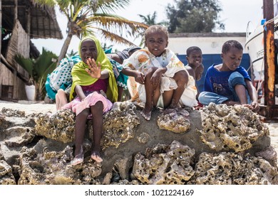 ZANZIBAR, TANZANIA - January 2018: African Kids On The Beach Smiling For Camera. Small African Girls And Boys Having Fun On The Beach, Tanzania