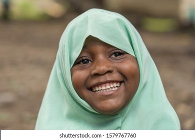 Zanzibar, Tanzania - october 30, 2019 : Unidentified african girl near a local school after class in island Zanzibar, Tanzania, East Africa