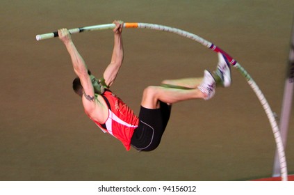 ZAPORIZHIA, UKRAINE - JAN.27: Denys Yurchenko On The Ukrainian Cup In Athletics, On January 27, 2012 In Zaporizhia, Ukraine. He Won Bronze Medal In The Pole Vault Event At Summer Olympics In Beijing.