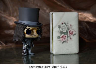 Zaporizhzhia, Ukraine - August 4, 2022: Illustrative Editorial Of Funko Pop Action Figure Of Bram Stoker's Dracula Vampire Standing On Marble Table Near Vintage Jewelry Box Like Coffin In Dark Room. 