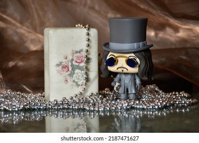 Zaporizhzhia, Ukraine - August 4, 2022: Illustrative Editorial Of Funko Pop Action Figure Of Bram Stoker's Dracula. Toy Standing On Marble Table In Dark Room. Exquisite Vintage Jewelry Box, Necklace. 