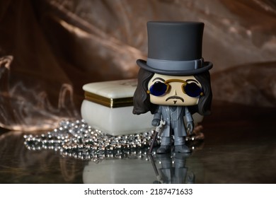 Zaporizhzhia, Ukraine - August 4, 2022: Illustrative Editorial Of Funko Pop Vinyl Action Figure Of Bram Stoker's Dracula Vampire Standing On Dark Table, Vintage Jewelry Box Like Coffin, Necklace.