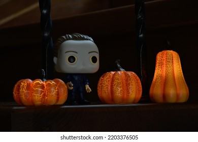 Zaporizhzhia, Ukraine - September 16, 2022: Funko Pop Vinyl Action Figure Of Serial Killer Michael Myers From Popular Horror Movie Halloween. Wooden Stairs In Dark House, Pumpkins, Spooky Atmosphere.