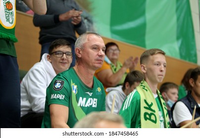 ZAPOROZHYA, UKRAINE - 09/20/2020- Spectators And Fans Emotionally During The COVID19 Pandemic In Masks Support Their Team In Stands Of Indoor Sports Hall Of Stadium. Sports Fans During  COVID Epidemic