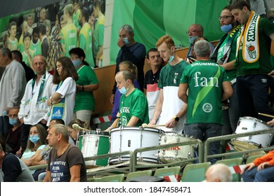 ZAPOROZHYA, UKRAINE - 09/20/2020- Spectators And Fans Emotionally During The COVID19 Pandemic In Masks Support Their Team In Stands Of Indoor Sports Hall Of Stadium. Sports Fans During  COVID Epidemic