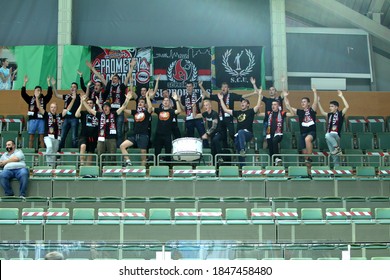 ZAPOROZHYA, UKRAINE - 09/20/2020- Spectators And Fans Emotionally During The COVID19 Pandemic In Masks Support Their Team In Stands Of Indoor Sports Hall Of Stadium. Sports Fans During  COVID Epidemic