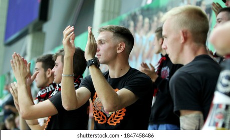 ZAPOROZHYA, UKRAINE - 09/20/2020- Spectators And Fans Emotionally During The COVID19 Pandemic In Masks Support Their Team In Stands Of Indoor Sports Hall Of Stadium. Sports Fans During  COVID Epidemic