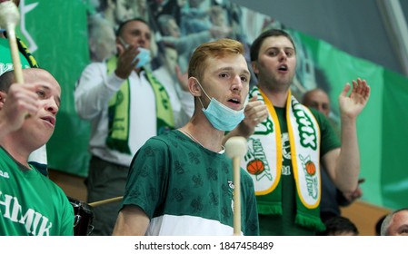 ZAPOROZHYA, UKRAINE - 09/20/2020- Spectators And Fans Emotionally During The COVID19 Pandemic In Masks Support Their Team In Stands Of Indoor Sports Hall Of Stadium. Sports Fans During  COVID Epidemic