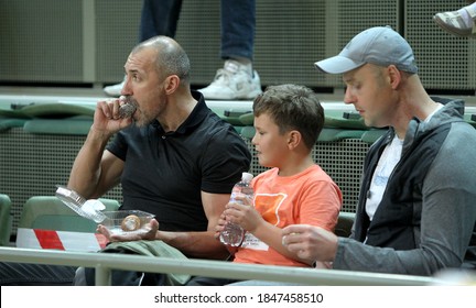 ZAPOROZHYA, UKRAINE - 09/20/2020- Spectators And Fans Emotionally During The COVID19 Pandemic In Masks Support Their Team In Stands Of Indoor Sports Hall Of Stadium. Sports Fans During  COVID Epidemic