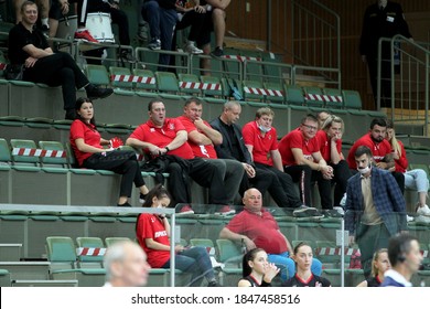 ZAPOROZHYA, UKRAINE - 09/20/2020- Spectators And Fans Emotionally During The COVID19 Pandemic In Masks Support Their Team In Stands Of Indoor Sports Hall Of Stadium. Sports Fans During  COVID Epidemic