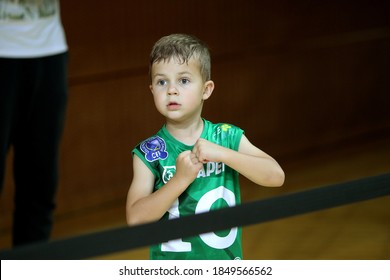 ZAPOROZHYA, UKRAINE - 09/20/2020- Spectators And Fans Emotionally During The COVID19 Pandemic In Masks Support Their Team In Stands Of Indoor Sports Hall Of Stadium. Sports Fans During  COVID Epidemic