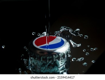 Zaporozhye Ukraine - May 13, 2022: Pepsi Cola cap close up. Drops of water on the cap of Pepsi Cola.