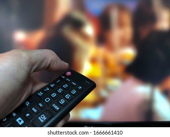 zapping with remote control in front of screen