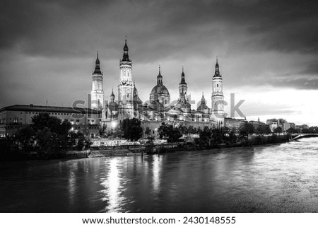 Zaragoza evening skyline; the Cathedral of the Pillar on the banks of river Ebro in Zaragoza, Aragon, Spain with vignetting effect
