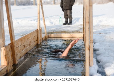 Zarinsk, Russia - January 19, 2019: Baptism Of The Lord, Plunge Into The Blessed Water, Winter Divine Holiday, Plunge Into The Icy Water