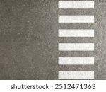 Zebra cross. Pedestrian crossing, white stripes on black asphalt, road markings, traffic rules. Graphic design texture.