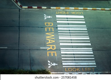 Zebra Crossing, On Urban Asphalt Road For Passenger Or People And Transportation At Night Time, Top View