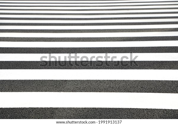 A zebra crossing in Tokyo, Japan.\
A zebra\
crossing is a type of pedestrian crossing used in certain places\
around the world.