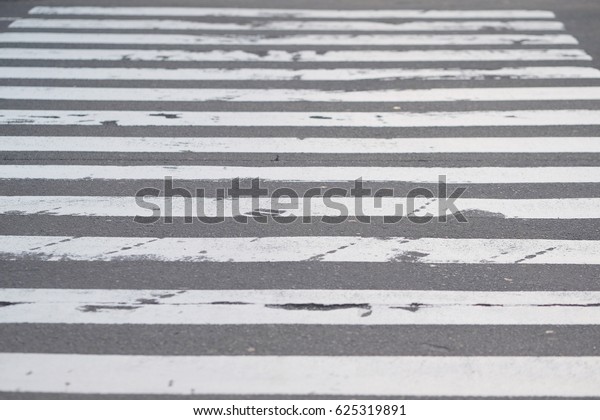 Zebra line crosswalk street. A pedestrian crossing
or crosswalk is a place designated for pedestrians to cross a road.
Crosswalks are designed to keep pedestrians together where they can
be seen.