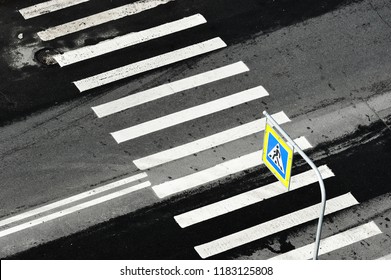 Zebra pedestrian crossing sign and pedestrian crossing - aerial view - road safety