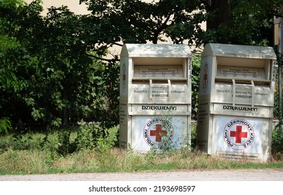 Zegrze, Poland - July 4, 2022 - Polish Red Cross, Containers For Used Clothing. Collection Of Clothes For Those In Need.