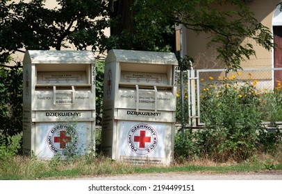 Zegrze, Poland - July 4, 2022 - Polish Red Cross, Containers For Used Clothing. Collection Of Clothes For Those In Need.