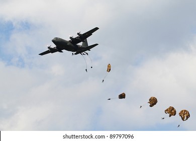ZELTWEG, AUSTRIA - JULY 01:paratroops and Herkules C130 at the airpower11 airshow on July 01, 2011 in Zeltweg, Austria