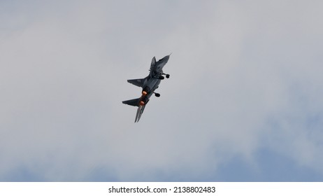 Zeltweg Austria SEPTEMBER, 2, 2016 Military Plane In Flight With Landing Gear Pulled Out And Lights On. Mikoyan MiG-29 Fulcrum Of Poland Air Force