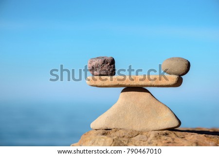Zen balance of stones at seashore