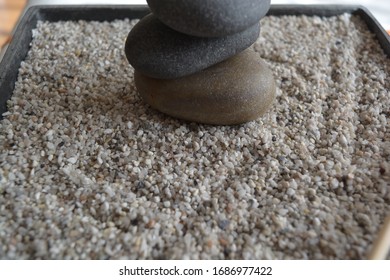 Zen Black Stones On The Box Sand Good For Meditation And Calm