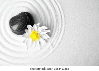 Zen Garden. Beautiful Lotus Flower And Stones On White Sand, Flat Lay