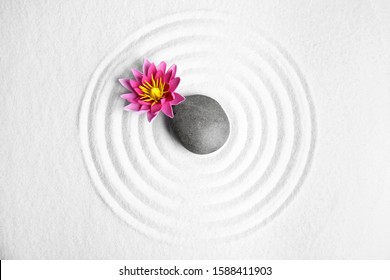 Zen Garden. Beautiful Lotus Flower And Stone On White Sand, Flat Lay