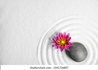 Zen Garden. Beautiful Lotus Flower, Stone And Space For Text On White Sand, Flat Lay