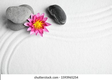 Zen Garden. Beautiful Lotus Flower, Stones And Space For Text On White Sand, Flat Lay