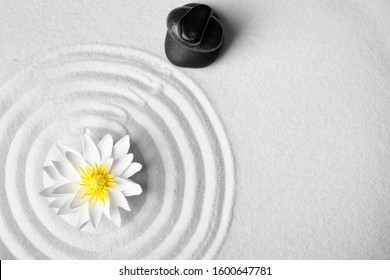 Zen Garden. Beautiful Lotus Flower, Stones And Space For Text On White Sand, Flat Lay