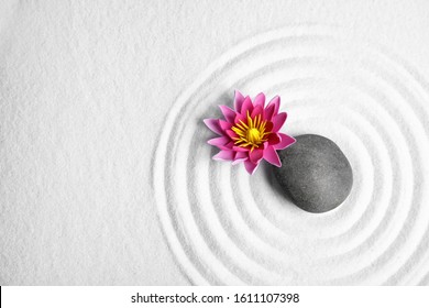 Zen Garden. Beautiful Lotus Flower, Stone And Space For Text On White Sand, Flat Lay