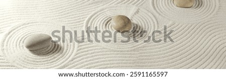 Zen garden with circle sand pattern and stones