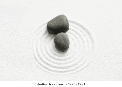 Zen Garden with Grey Stone on White Sand Line Texture Background, Top View Black Rock Sea Stone on Sand Wave Parallel Lines Pattern in Japanese stye, Simplicity Day, Meditation,Zen like concept - Powered by Shutterstock